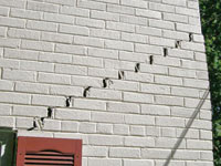 Stair-step cracks showing in a home foundation in Northampton